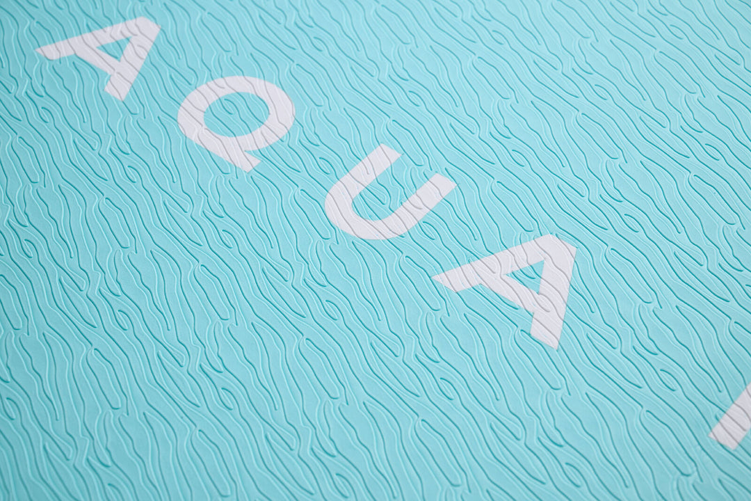 Close-up of the sand-ripple grooved EVA footpad on the Aqua Marina Breeze
