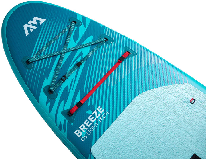 Nose of the Aqua Marina Breeze showing the RED STRAP bungee cargo system and printed deck design