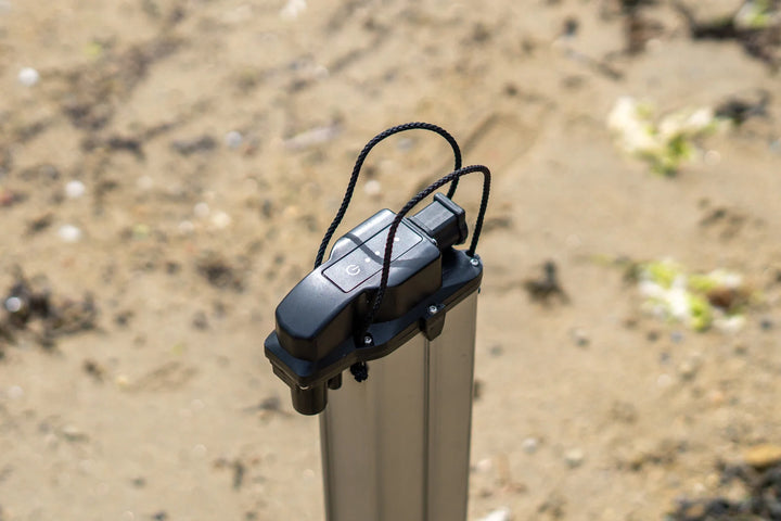 TEMO 1000 battery showing its ON/OFF button and charge-level indicator