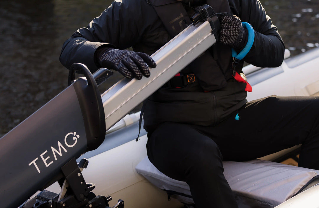 949 Wh battery being slotted into a TEMO 1000 electric outboard motor