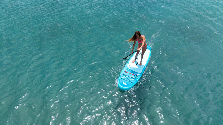 Aerial view of the Aqua Marina Breeze inflatable paddle board on turquoise water