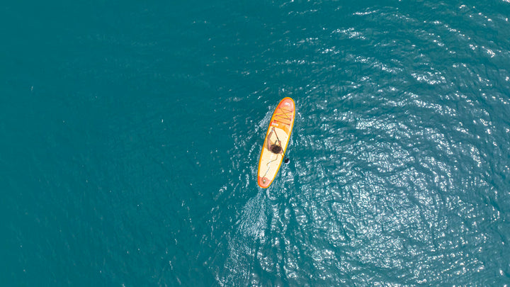 Aerial view of the 2026 Aqua Marina Fusion inflatable SUP on turquoise water