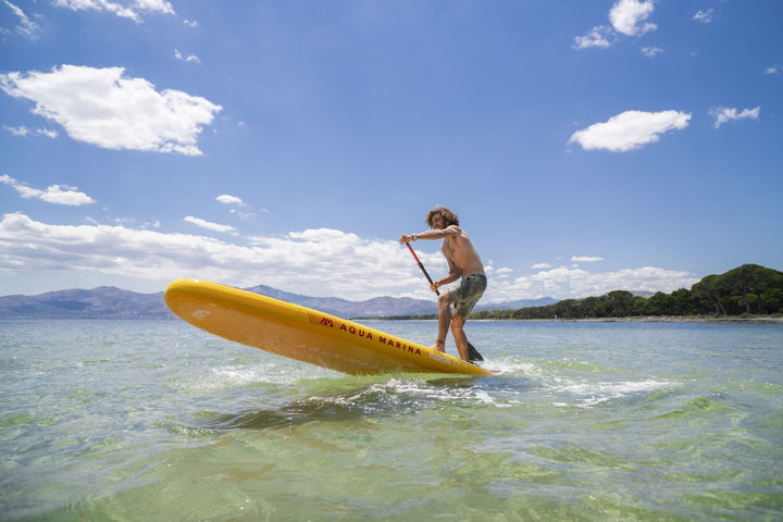 Aqua Marina Fusion 10'10" inflatable paddle board lifting its nose during a step-back turn