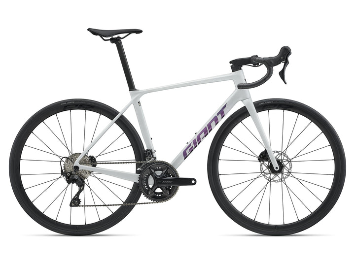 Giant 2027 TCR Advanced 2 KOM road bike in Pearl White with purple graphics, side view
