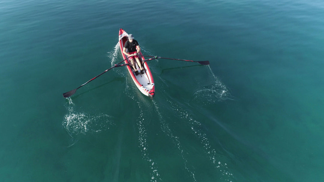Aerial view of a ROWonAIR AIRKAYAK 16 inflatable kayak under way on open water