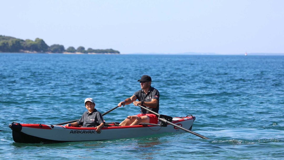 AIRKAYAK 16 inflatable kayak cutting through light chop