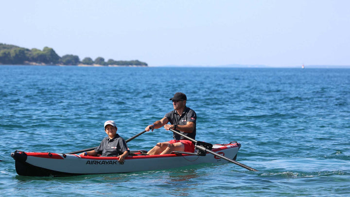 AIRKAYAK 16 inflatable kayak cutting through light chop