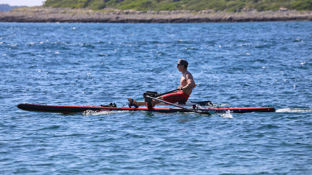 DUDE 18 inflatable rowing board under way with a passenger aboard