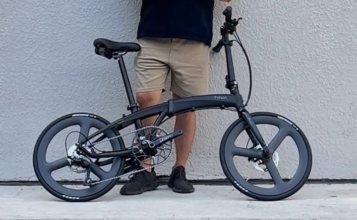 Matte black Fnhon 20-inch folding bike with carbon tri-spoke wheels front and rear, Carbon Tri-Spoke version, side view