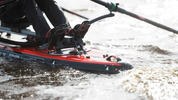 MOJO 18 rowing board under way at speed with the bow lifted by the rocker line