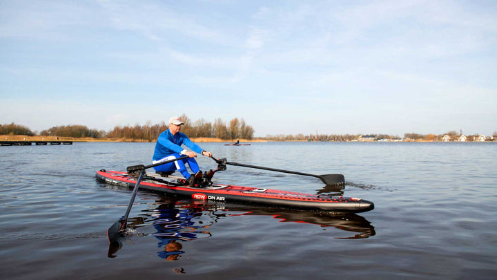 MOJO 18 inflatable rowing board rigged with a rowing skid and carbon sculls