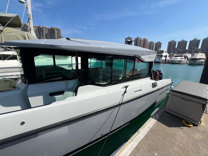 Saxdor 320 GTC starboard profile showing the fully enclosed glass wheelhouse and 320 GTC hardtop badge